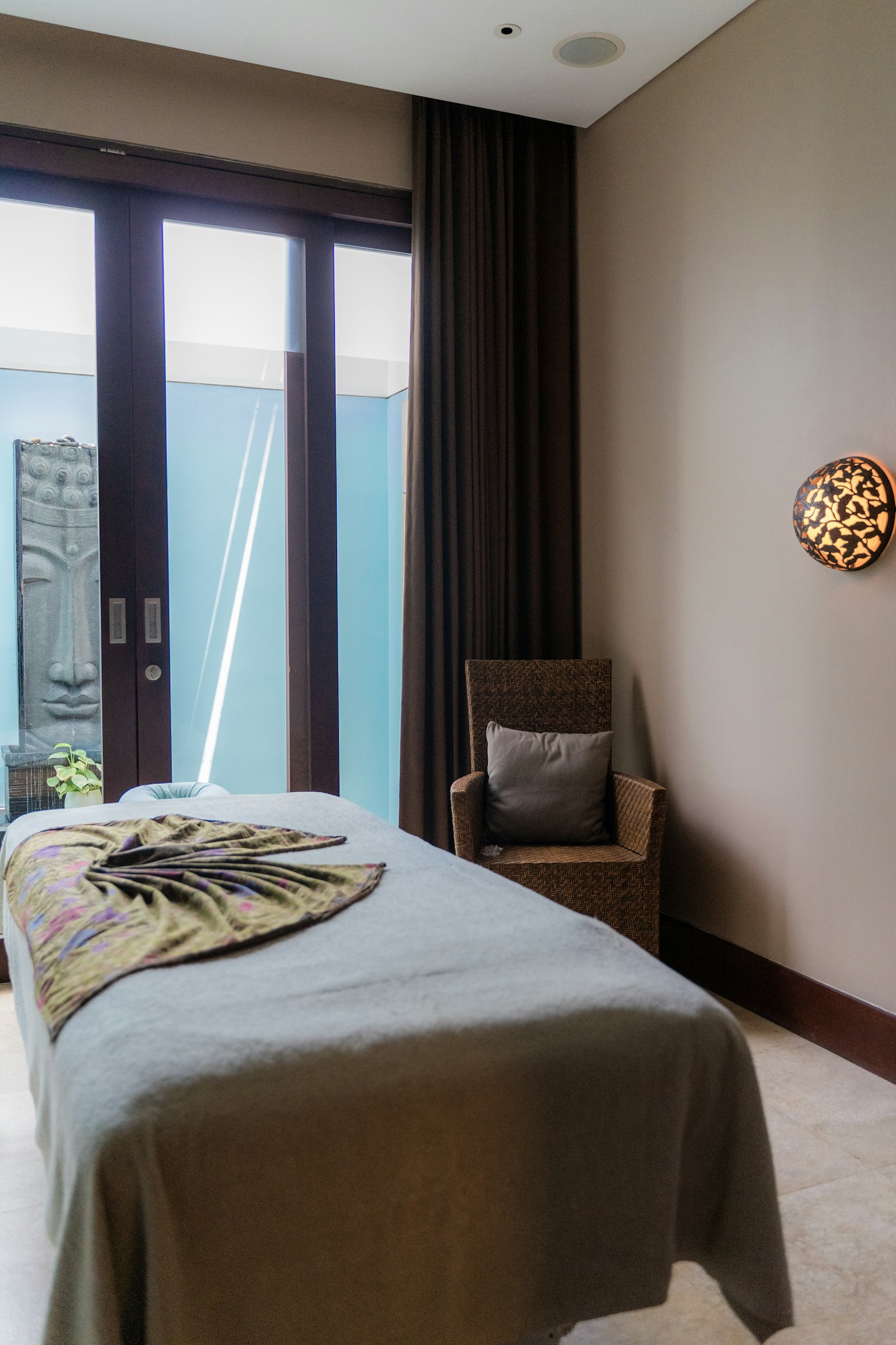 Spa treatment bed beside a window, stock photograph